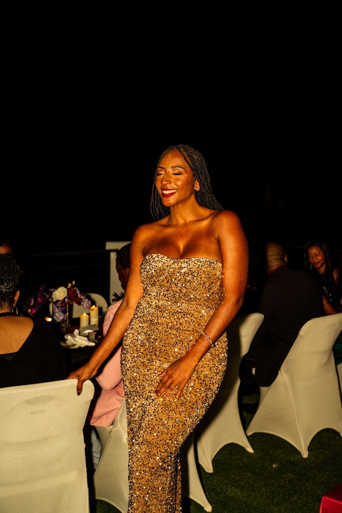Authentic photograph: Markesha at a recent Rare Company rooftop gathering, continuing the rooftop tradition the first Rich Life Experience began