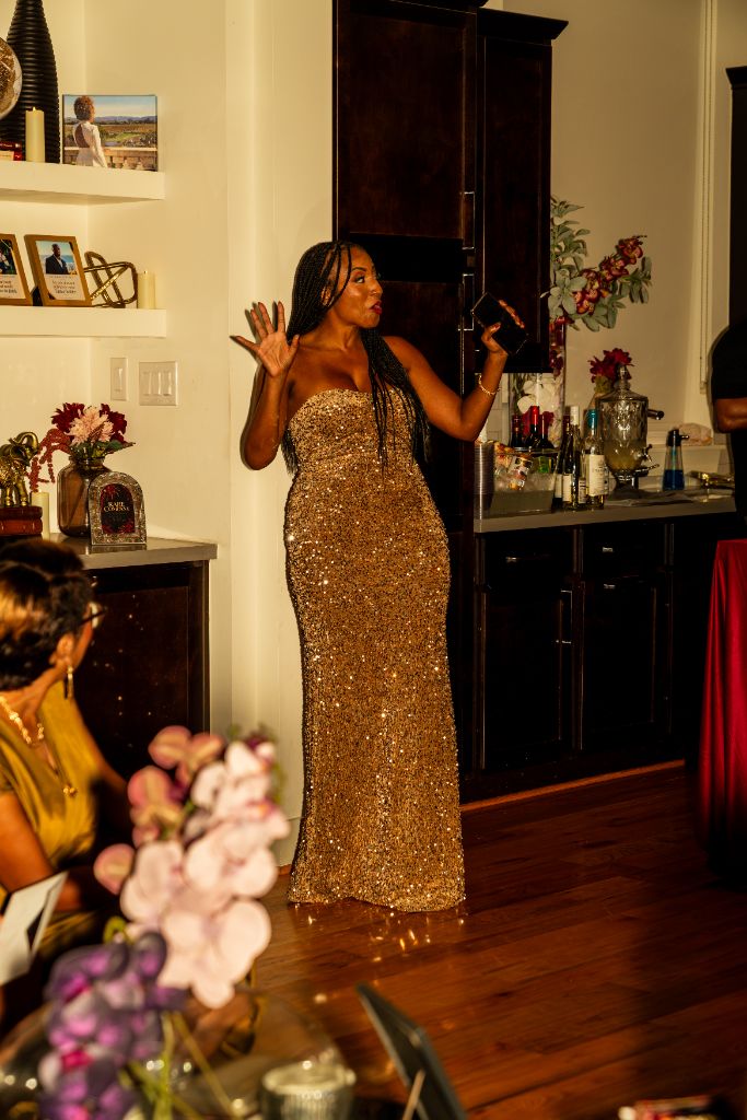 Authentic photograph: Markesha presenting to a room of guests at a real Rare Company event